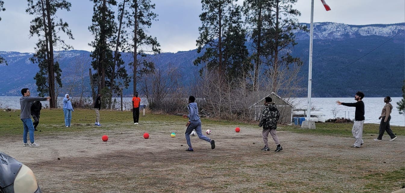 Junior youth playing sports together outdoors